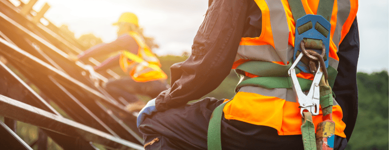 Safety officer implementing workplace safety strategies on a construction site.