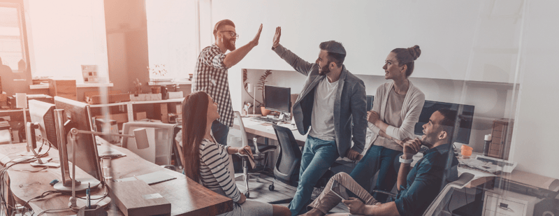 Diverse team collaborating in a workplace culture built on dignity and respect.
