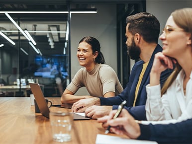 Engaged team sharing a positive moment together during an office meeting