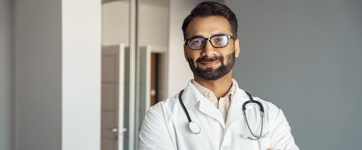 Portrait of male doctor wearing white lab coat