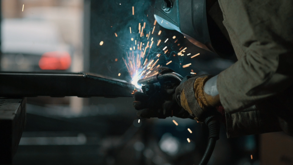 Welder Working in Factory